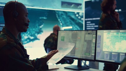 Poster - Telecommunications operator transmitting live information from satellite CCTV footage, supporting field troops with essential data. Federal agency working on reconnaissance system. Camera B.