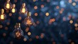 © ngamaz - Illuminated Light Bulbs Against a Bokeh Background.