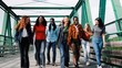 © Vane Nunes - Young multiracial group of friends having fun in travel vacations. Multi-cultural people walking on city bridge