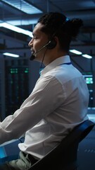Poster - vertical video data center computer scientist wearing mic headset, doing installation of networking 