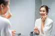 © Kawee - Asian beautiful woman putting smooth and skin care for facial soft.