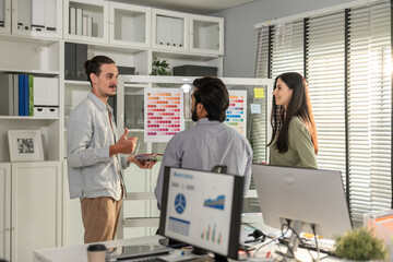 Wall Mural - Group of Asian businessman and businesswoman working in the office.