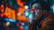 © CreativeIMGIdeas - Upset Asian man looking at stock exchange data and chart graphs, representing emotional response to financial market difficulties.