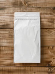 Wall Mural - White packaging bag mockup on wooden table, top view with header seal, suitable for branding presentation.