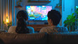 © Chatchanan - Relaxed Asian couple enjoying their leisure time with a TV show at home