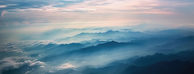 Sticker - Majestic Mountain Ranges Shrouded in Mist at Dusk