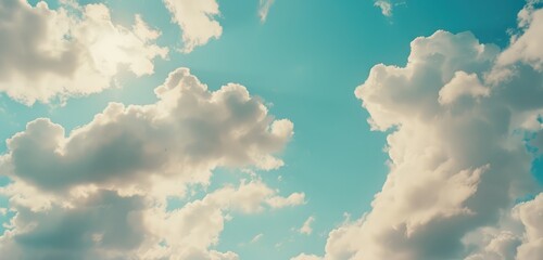 Wall Mural - Serene Blue Sky with Fluffy White Clouds