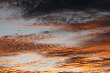 Wall Mural - sky and clouds dramatic background with orange colors