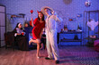 © Pixel-Shot - Young couple in costumes at Halloween party