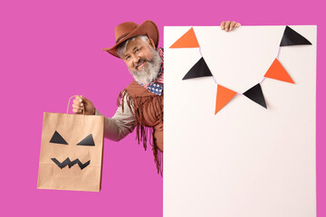 Canvas Print - Mature man dressed for Halloween with gift bag and blank poster on pink background