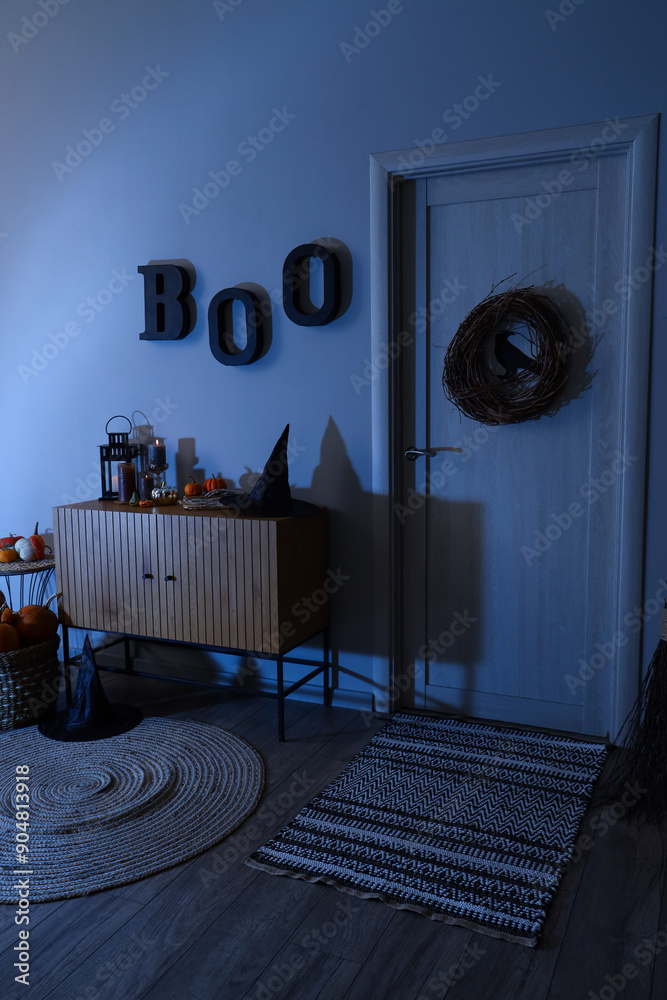 Interior of festive hallway with Halloween decorations at night