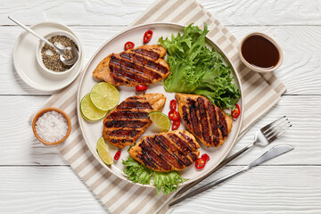 Wall Mural - grilled chicken breasts wrapped in bacon on plate