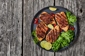 Poster - grilled chicken breasts wrapped in bacon on plate