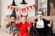© Pixel-Shot - Little children celebrating Halloween at home