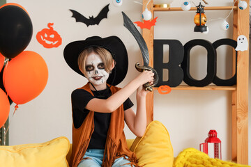 Wall Mural - Little boy celebrating Halloween at home