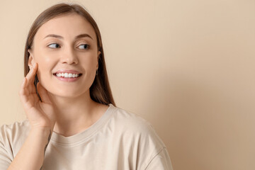 Poster - Beautiful woman with healthy skin on beige background, closeup