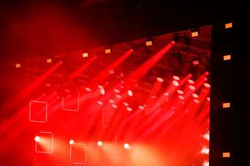 Wall Mural - Red-orange color on stage at a concert