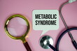 © may1985 - Metabolic Syndrome text with stethoscope and magnifying glass on pink background, Healthy and wellness concept