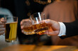 © aekachai - Celebrate whiskey on a friendly party in restaurant