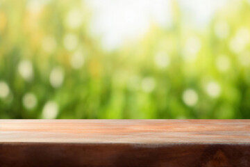 Poster - Empty wooden tabletop with blurred green nature background, ready for product display montage