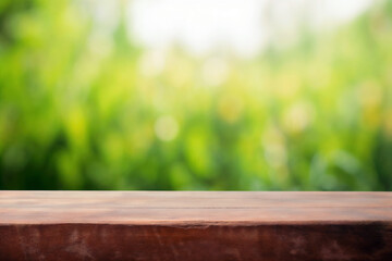 Poster - Wooden table top on blur green nature background, can be used for display or montage your products