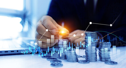 Poster - Businessman hand putting money coin stack with growing business graph. Saving money concept. Financial growth data or investment market profit bar and success report.