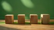 © Emin - Displaying six empty wooden square cubes on a table with a green background for custom text Concept of environment energy or business Front view with banner space