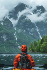 Poster - A person in an orange jacket kayaks through the tranquil fjords of Norway, surrounded by lush mountains and cascading waterfalls