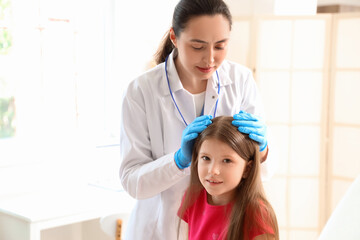 Poster - Female doctor checking little girl's head for pediculosis in clinic