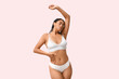 © Pixel-Shot - Young African-American woman in underwear on pink background