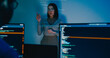© tirachard - Group adult Asia female software developer mentor leader manager talk strategy plan to executive write prompt AI bot IT app program nomad, video game, designer, data center. Projecting slideshow code.
