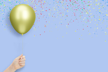 Aufkleber - Female hand holds golden balloon on blue background with confetti. Empty space for text