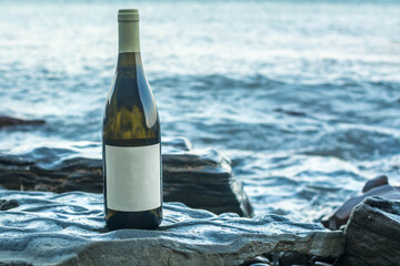 Poster - Bottle of wine by the sea