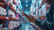 © Borin - A manager using a tablet to monitor real-time inventory data on a cloud-based platform.