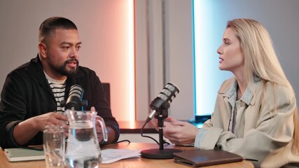 Fototapete - Podcast, interview and people with mic in discussion for broadcast, recording and guest on talk show. News, info and host with conversation at desk for live streaming, production and content creation