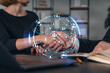 © VideoFlow - Business handshake with digital network overlay in office setting.