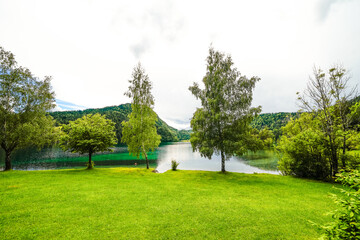 Wall Mural - Landscape at Hintersteiner See near Scheffau in Tyrol. Idyllic nature at the mountain lake in the Wilder Kaiser nature reserve in Austria.
