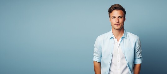 Wall Mural - A man in a blue shirt and white shirt is smiling and looking at the camera