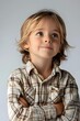 © Adobe Contributor - Curious Boy with Arms Crossed