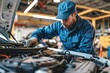 © ttonaorh - Car mechanic working in auto repair service. Closeup of auto mechanic hands repairing car engine