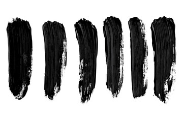 strokes of black paint, brush, roller, spatula. collection of brushes smears of paint on a white bac