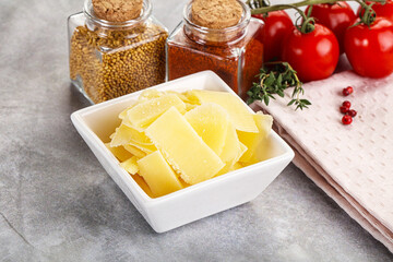 Canvas Print - Sliced parmesan cheese in the bowl