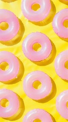Poster - Bright and Vibrant Pattern of Pink Inflatable Rings on Soft Yellow Background Evoking Sunny Beach Vibes