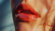 © VK Studio - Close-up shot of luscious, glossy red lips, slightly parted, illuminated by soft lighting.
