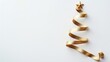 © Sanja - Golden ribbon Christmas tree with star on white background, New year concept. Copy space.