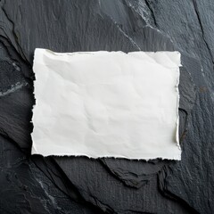 Wall Mural - blank wrinkled paper over on a stone on a dark background