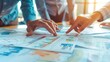 © AhmadTriwahyuutomo - Closeup of Business Meeting Table with Documents and Graphs in Bright Daylight Office