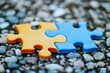 © id512 - blue and yellow jigsaw puzzle pieces on a pebble surface business connection and diversity concept