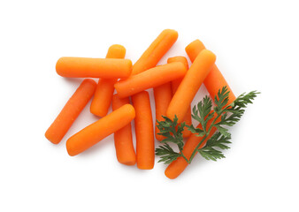 Wall Mural - Many baby carrots and green leaf isolated on white, top view