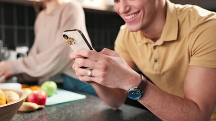 Poster - Phone, couple and hands of happy man in kitchen while cooking lunch together with woman. Mobile, reading and app for recipe, dinner blog and scroll food tutorial for healthy diet on internet in home